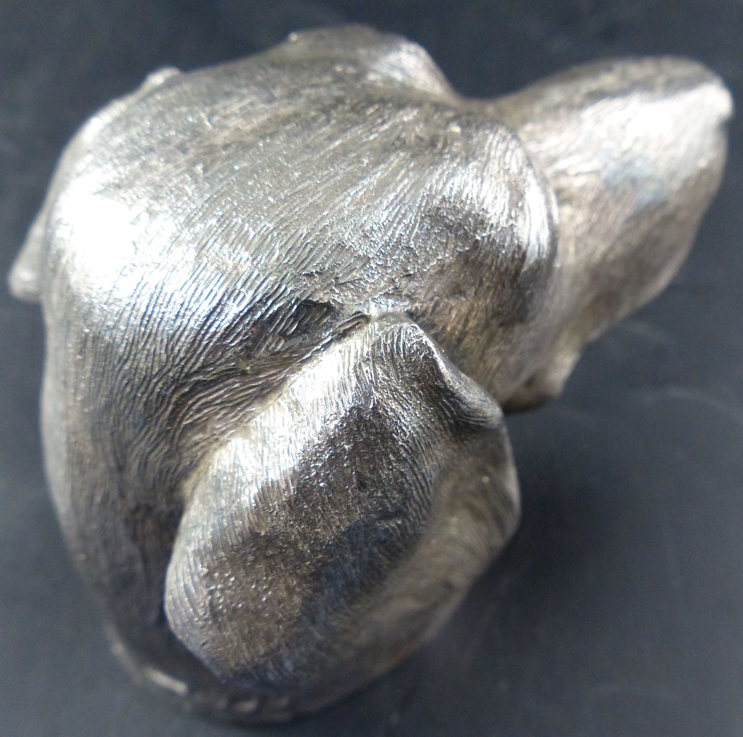 A modern silver mounted table lighter modelled as a dogs head, 7cm.